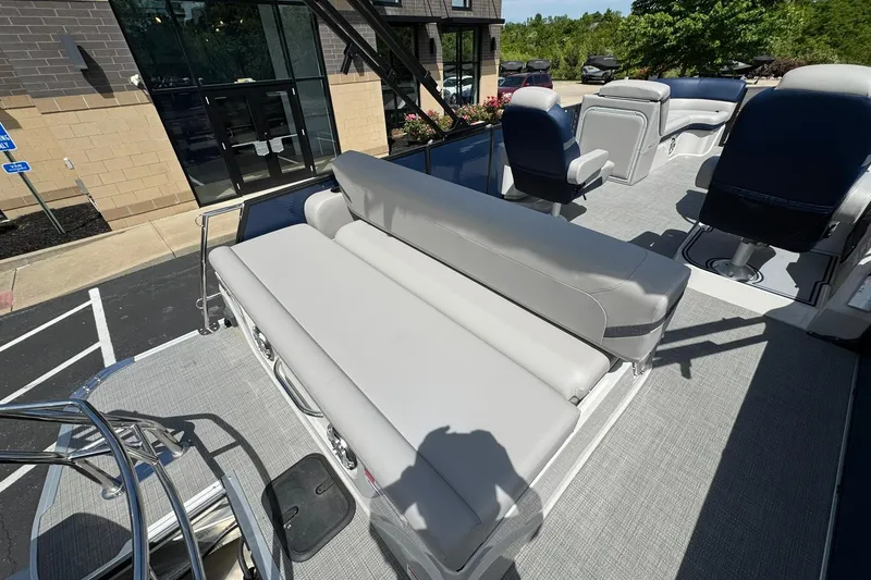 Slide: The Image of 2024 Crest Caribbean LX 230 boat with spacious seating and modern design. - 13