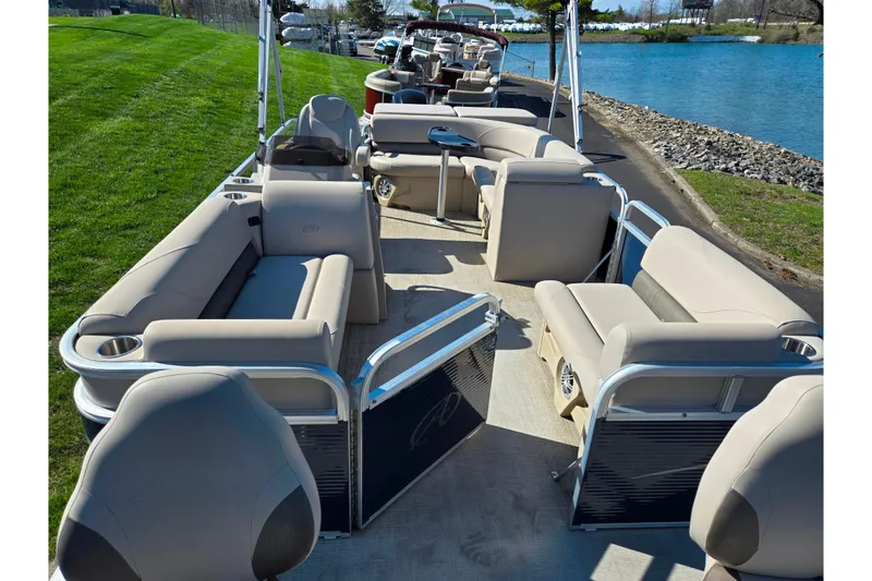 Slide: The Image of 2020 Avalon Venture Cruise Bow Fish pontoon boat with spacious seating by a lake. - 11
