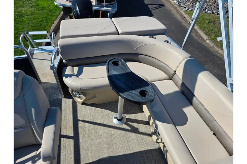 Slide: The Image of 2020 Avalon Venture Cruise Bow Fish boat interior with beige seating and black table. - 16