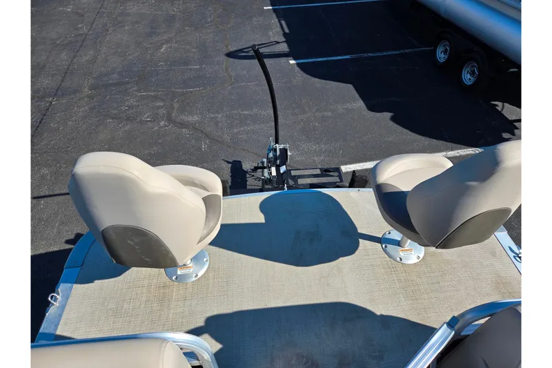 Slide: The Image of 2020 Avalon Venture Cruise Bow Fish boat with two swivel seats on deck. - 24