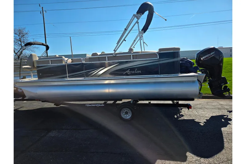 Slide: The Image of 2020 Avalon Venture Cruise Bow Fish pontoon boat on trailer, side view. - 4
