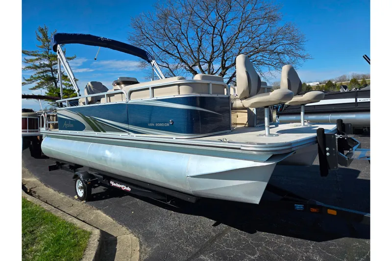 Slide: The Image of 2020 Avalon Venture Cruise Bow Fish pontoon boat on trailer, parked outdoors. - 8