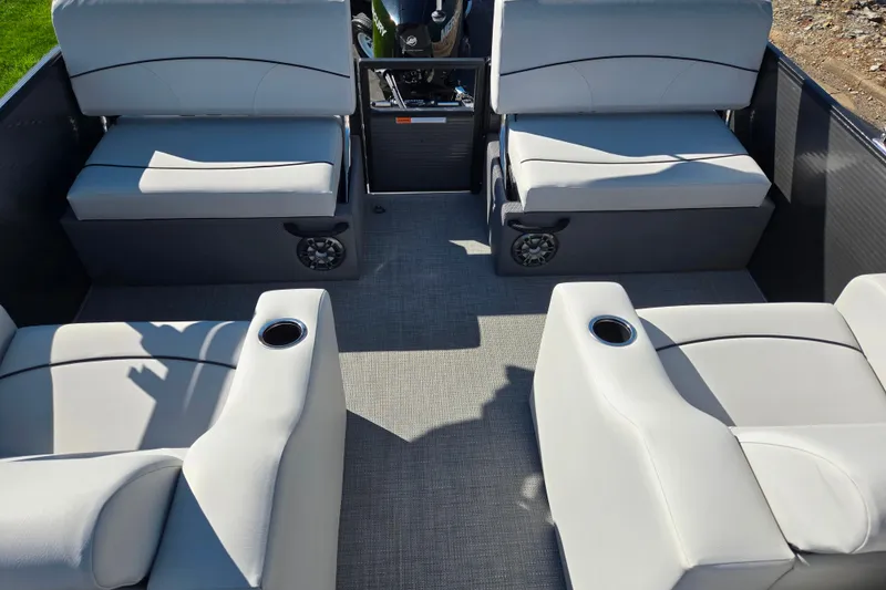 Slide: The Image of 2022 Crest Classic LX 220 SLRC boat interior with gray seating and cup holders. - 16
