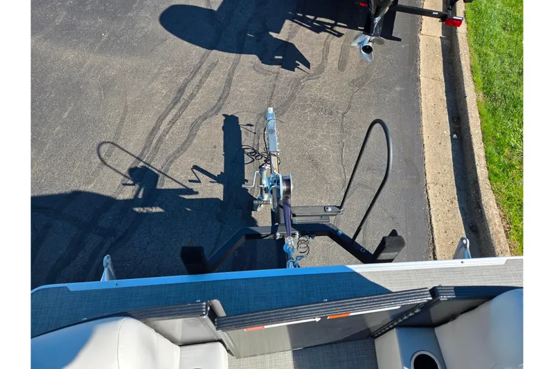 Slide: The Image of Top view of a 2022 Crest Classic LX 220 SLRC boat trailer hitch on pavement. - 24