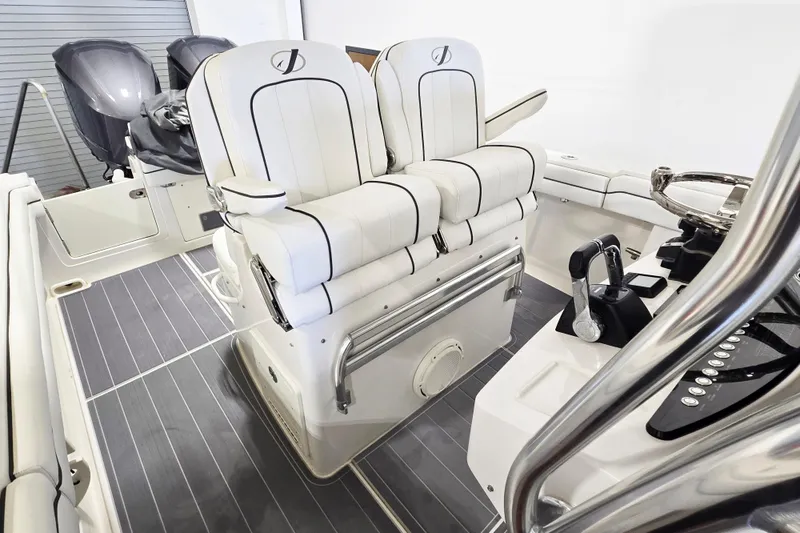 Slide: The Image of 2017 Jupiter 30 HFS boat interior with dual seats and control panel. - 11