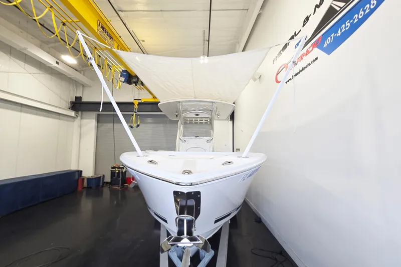 Slide: The Image of 2017 Jupiter 30 HFS boat in indoor storage with protective cover. - 3