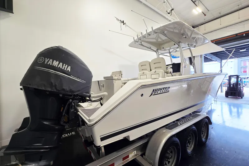 Slide: The Image of 2017 Jupiter 30 HFS boat with Yamaha engine on trailer in indoor setting. - 4