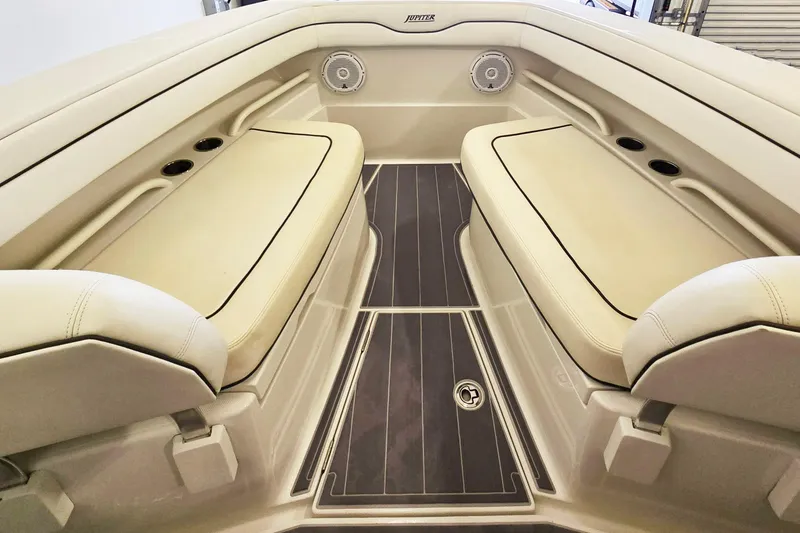 Slide: The Image of Luxurious interior of a 2017 Jupiter 30 HFS boat with cushioned seating. - 6