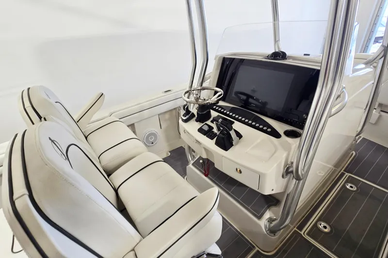 Slide: The Image of 2017 Jupiter 30 HFS boat cockpit with dual seats and modern control panel. - 9