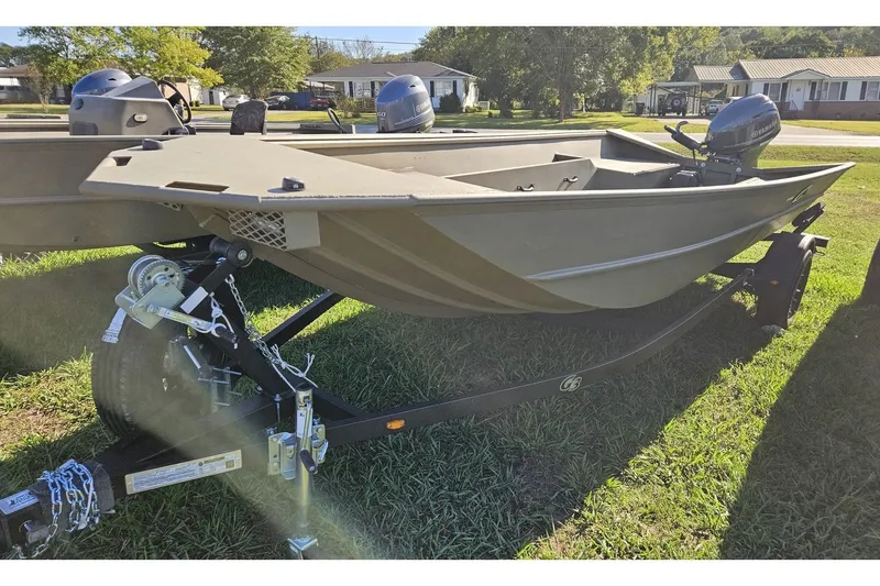 The Image of 2024 G3 Gator Tough 18 DK boat on trailer outdoors. - 1