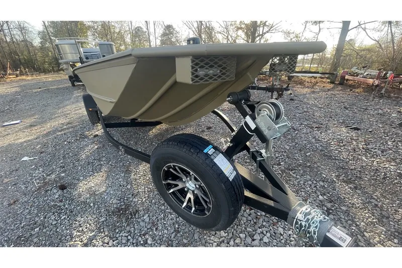 Slide: The Image of 2024 G3 Gator Tough 18 DK boat on trailer outdoors. - 12