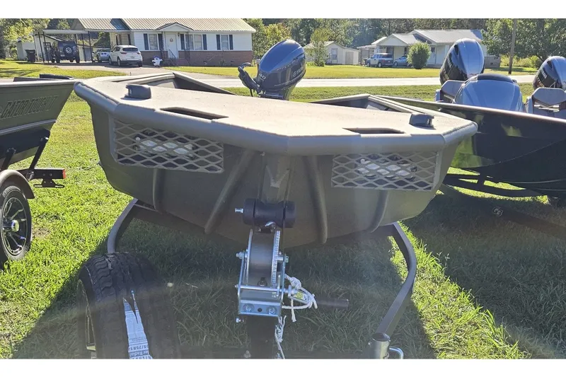 Slide: The Image of 2024 G3 Gator Tough 18 DK boat on trailer outdoors. - 4