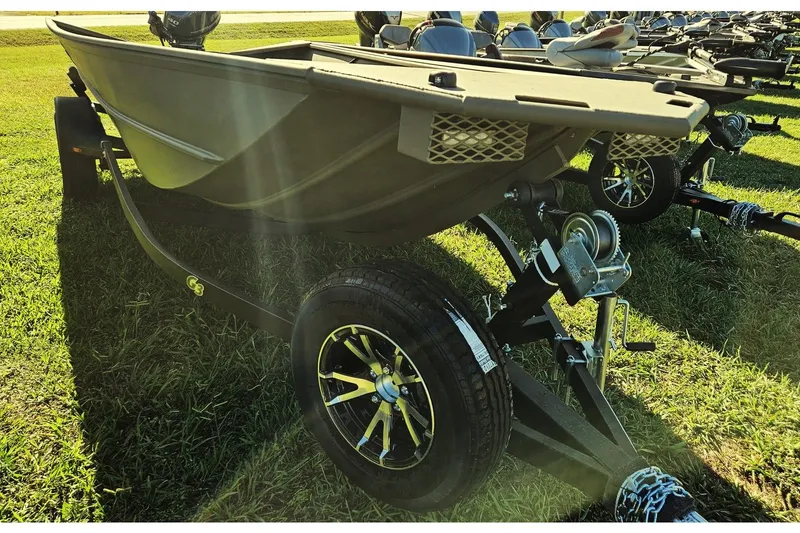 Slide: The Image of 2024 G3 Gator Tough 18 DK boat on trailer outdoors. - 5