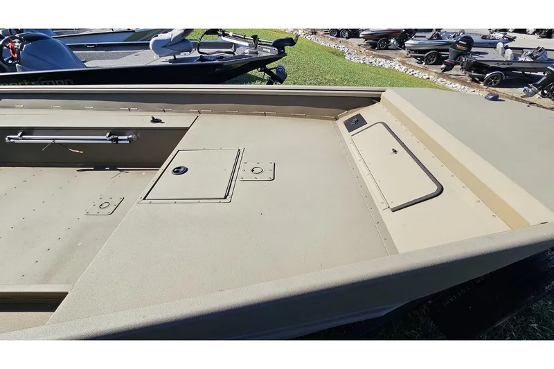 Slide: The Image of 2024 G3 Gator Tough 18 DK boat deck with storage compartments. - 6