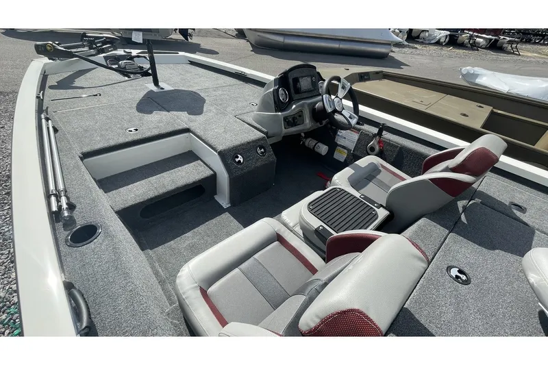 Slide: The Image of Interior view of 2023 G3 Sportsman 1710 boat with gray carpeting. - 12