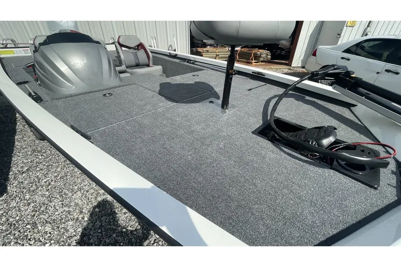 Slide: The Image of 2023 G3 Sportsman 1710 boat with gray carpeted deck. - 8