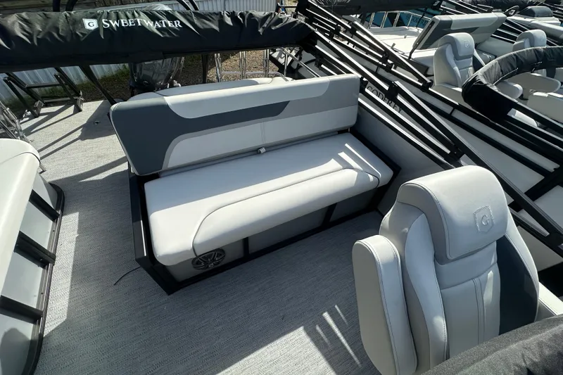 Slide: The Image of 2026 Godfrey Sweetwater 2286 SFL boat interior with gray seating and sleek design. - 11