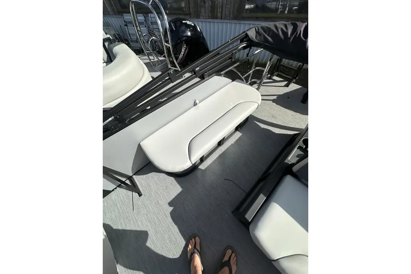 Slide: The Image of 2026 Godfrey Sweetwater 2286 SFL boat interior with seating and flooring. - 19