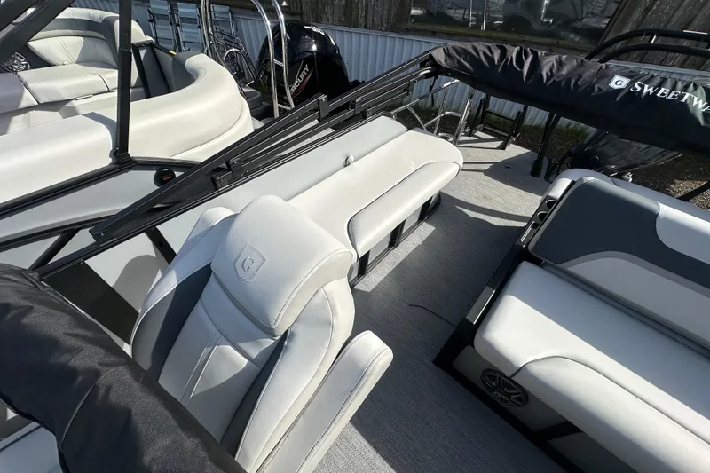 Slide: The Image of 2026 Godfrey Sweetwater 2286 SFL pontoon boat interior with white seating and modern design. - 12