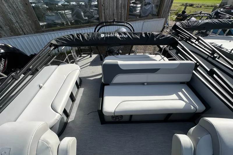 Slide: The Image of 2026 Godfrey Sweetwater 2286 SFL pontoon boat interior with gray seating and black accents. - 13