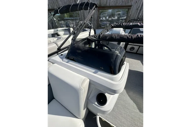 Slide: The Image of 2026 Godfrey Sweetwater 2286 SFL boat interior with sleek seating and windshield. - 16
