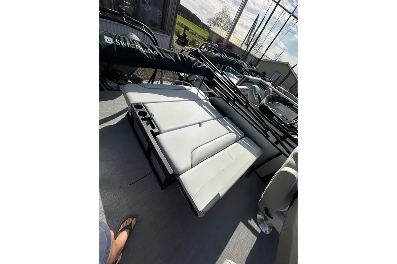 Slide: The Image of 2026 Godfrey Sweetwater 2286 SFL pontoon boat with white seating and cup holders. - 23