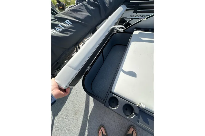 Slide: The Image of 2026 Godfrey Sweetwater 2286 SFL boat interior with seating and cup holders. - 25