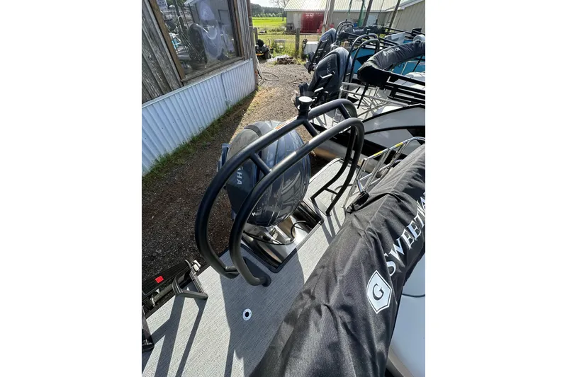 Slide: The Image of 2026 Godfrey Sweetwater 2286 SFL pontoon boat with Yamaha engine, outdoor display. - 26