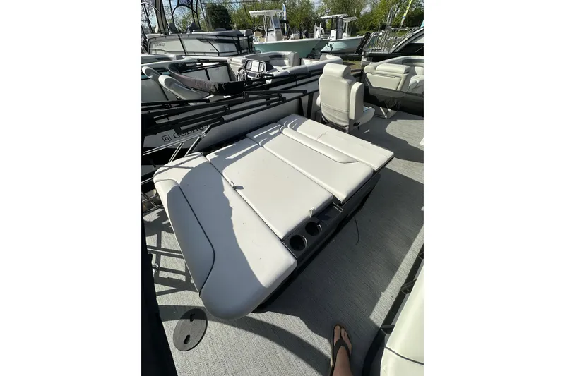 Slide: The Image of 2026 Godfrey Sweetwater 2286 SFL pontoon boat interior with seating and cup holders. - 27