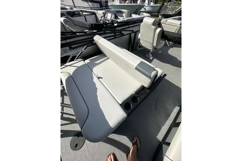 Slide: The Image of 2026 Godfrey Sweetwater 2286 SFL boat interior with seating and cup holders. - 28