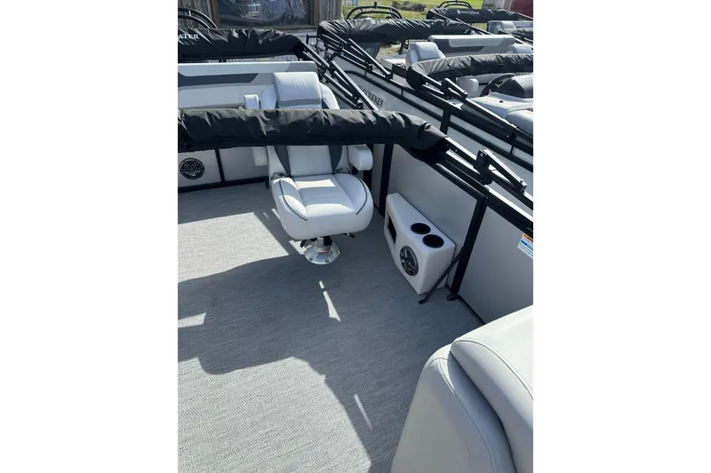 Slide: The Image of 2026 Godfrey Sweetwater 2286 SFL boat interior with seating and cup holders. - 5