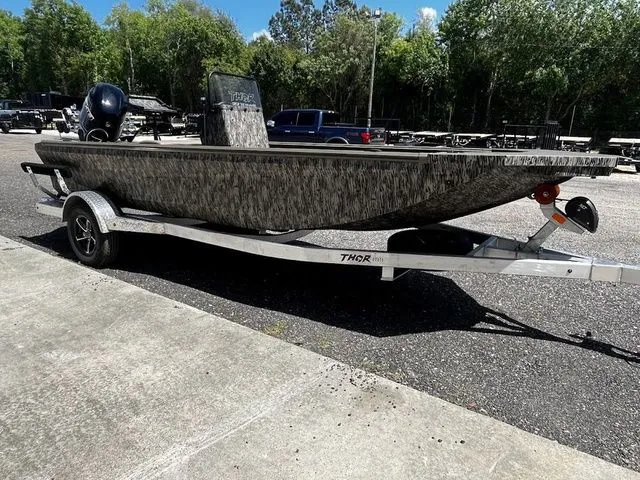 The Image of 2026 Thor LH1900CC boat on trailer parked outdoors. - 1