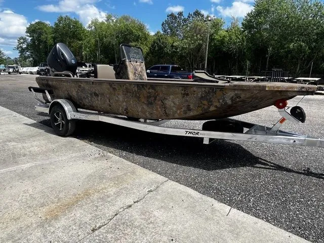 Slide: The Image of 2026 Thor LH1900CC boat with Baystar steering on trailer. - 14