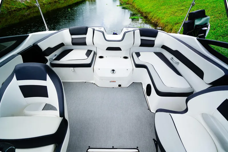 Slide: The Image of 2023 Yamaha Boats SX195 interior with sleek seating and modern dashboard design. - 11