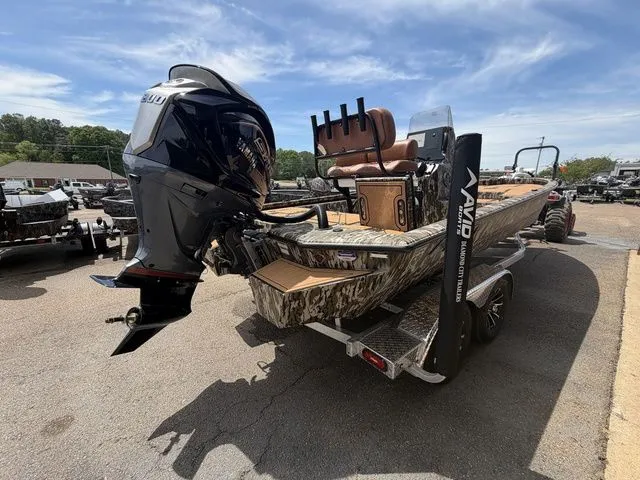 Slide: The Image of Avid 21 MAG ST boat from 2026 with outboard motor on trailer. - 10