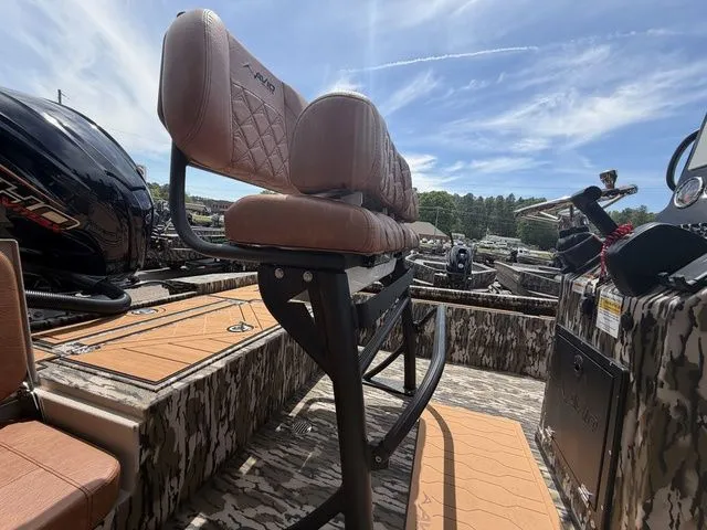 Slide: The Image of Avid 21 MAG ST 2026 boat with cushioned seats and camouflage design. - 14