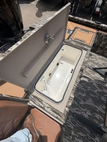 Slide: The Image of Avid 21 MAG ST 2026 boat with open storage compartment. - 15