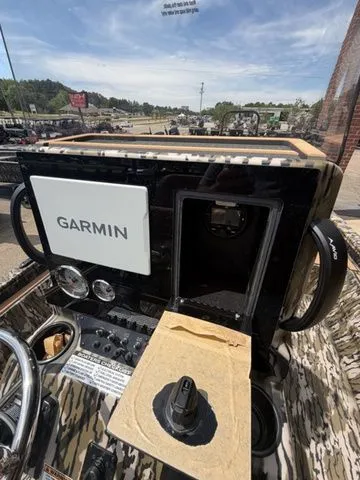 Slide: The Image of Avid 21 MAG ST 2026 boat console with Garmin navigation system. - 16
