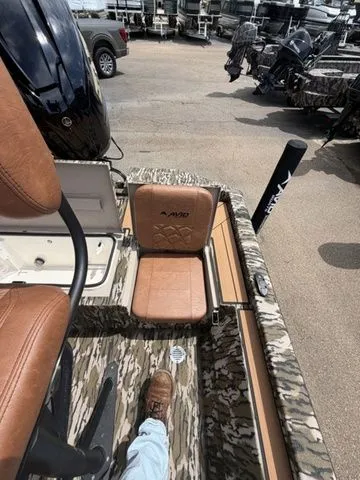 Slide: The Image of Avid 21 MAG ST 2026 boat with camouflage design and leather seats. - 24