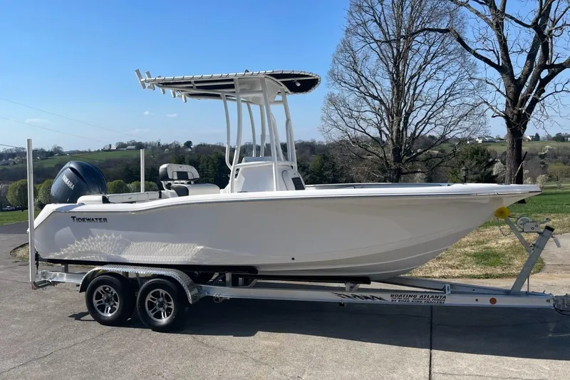The Image of 2023 Tidewater 210 LXF boat on trailer, parked outdoors. - 0