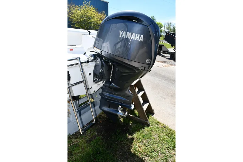 Slide: The Image of 2023 Tidewater 210 LXF boat with Yamaha outboard motor and ladder on display. - 19
