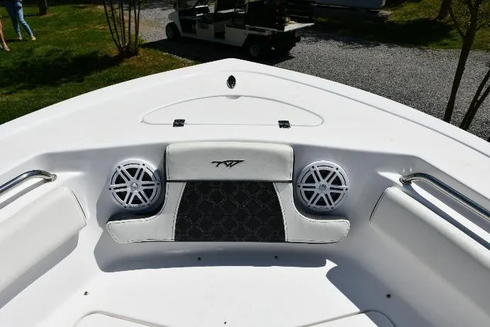 Slide: The Image of 2023 Tidewater 210 LXF boat bow with speakers and seating, featuring sleek design elements. - 6