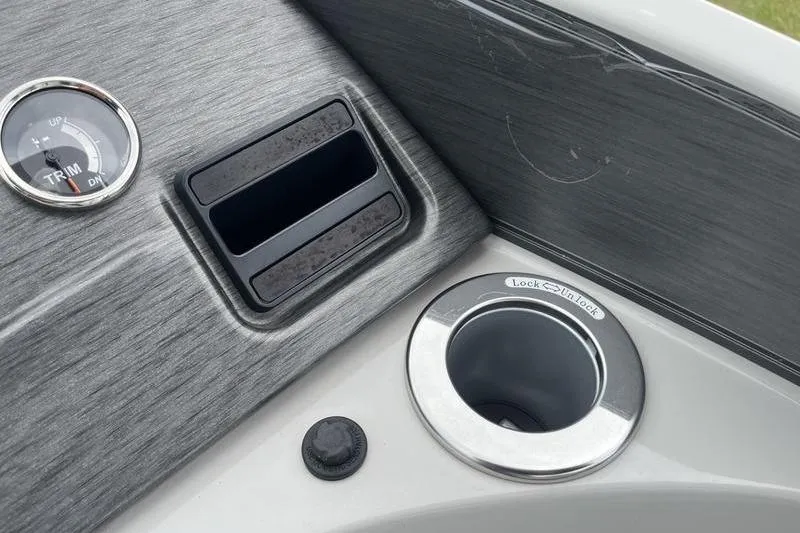 Slide: The Image of 2024 Crest Classic Platinum 240 SLC dashboard with trim gauge and cup holder. - 14