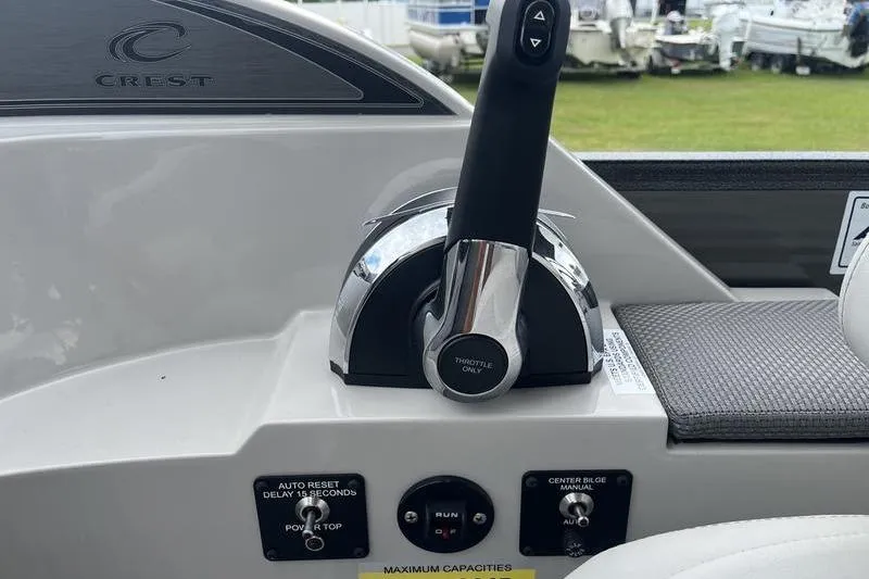 Slide: The Image of Throttle control panel of 2024 Crest Classic Platinum 240 SLC boat. - 15