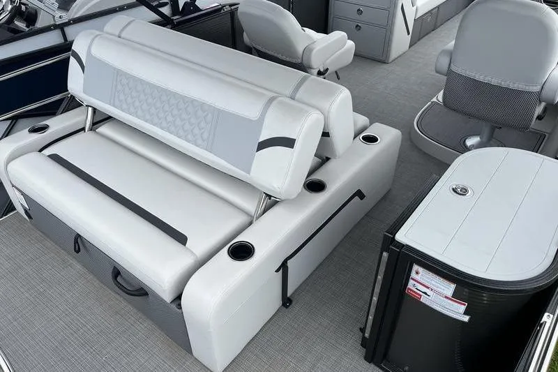 Slide: The Image of 2024 Crest Classic Platinum 240 SLC boat interior with luxurious seating and modern design. - 4