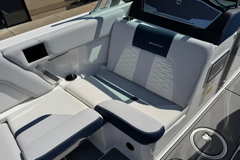Slide: The Image of 2021 MasterCraft X24 boat interior with luxurious seating and modern design. - 11
