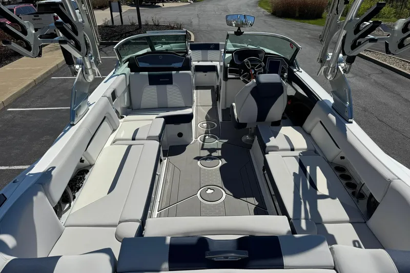 Slide: The Image of 2021 MasterCraft X24 boat interior with luxurious seating and modern dashboard design. - 14