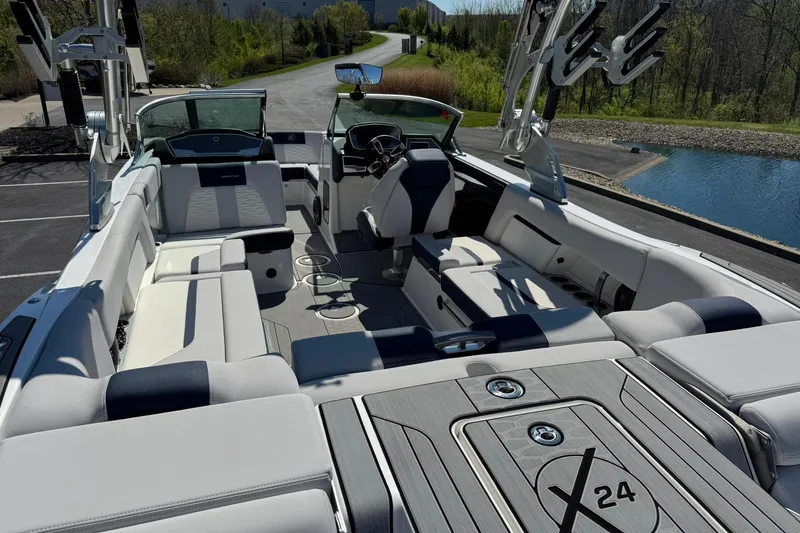 Slide: The Image of 2021 MasterCraft X24 boat interior with luxurious seating and modern design. - 15