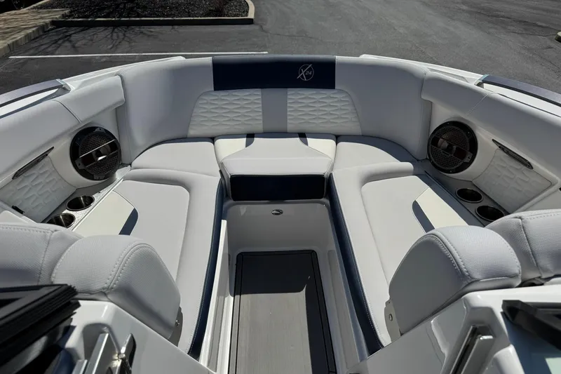 Slide: The Image of Interior of a 2021 MasterCraft X24 boat with luxurious seating and speakers. - 8