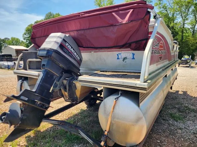 Slide: The Image of 1998 Sun Tracker BASS BUGGY 18 pontoon boat with outboard motor. - 4